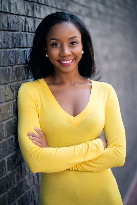 Professional Portrait Headshot Black Woman on black brick wall